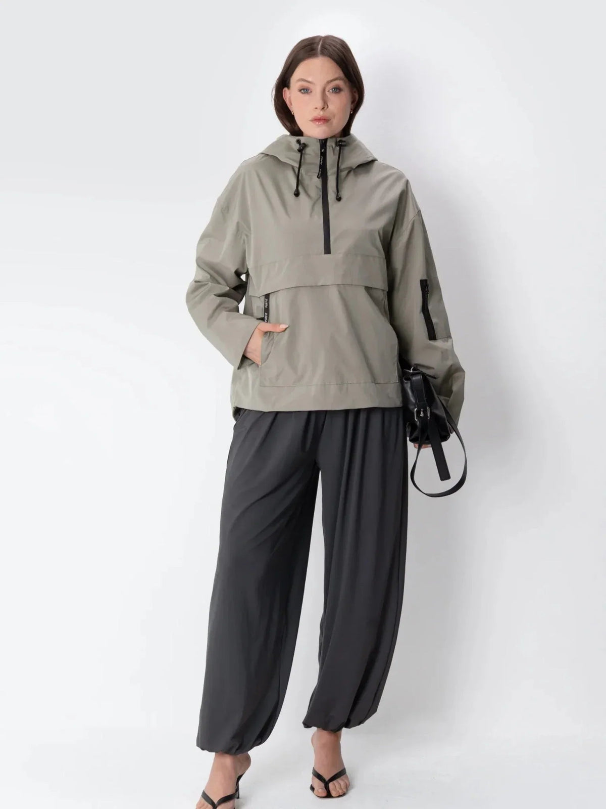 Model wearing the PUFFIT STM-TEX Classic Relaxed Fit Rain Hoodie