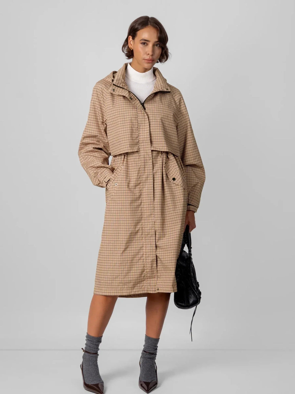 PUFFIT STM-TEX elevated long raincoat, shown as a full length women's rainwear option